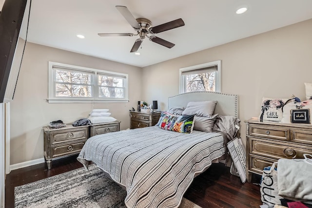 bedroom with ceiling fan and dark hardwood / wood-style floors