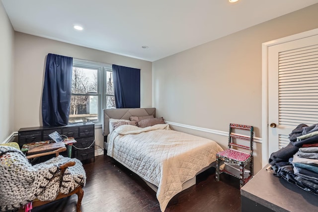 bedroom with dark wood-type flooring