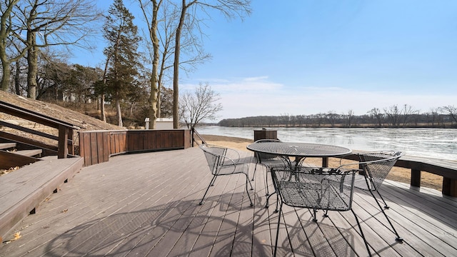 wooden deck featuring a water view