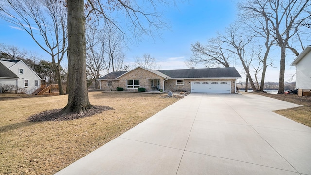 view of front of house featuring a garage and a front yard