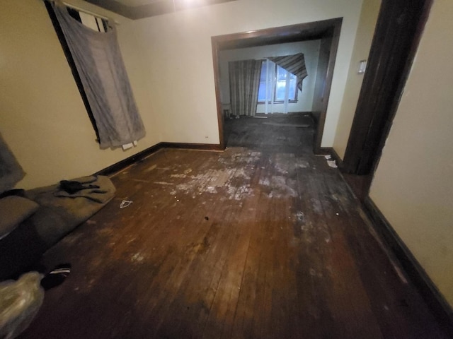 corridor featuring dark hardwood / wood-style floors