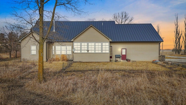 exterior space with metal roof