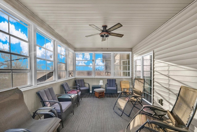 sunroom featuring ceiling fan and a healthy amount of sunlight