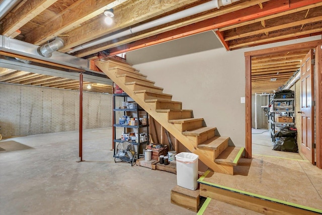 unfinished below grade area featuring stairs