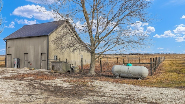 exterior space featuring a rural view and fence