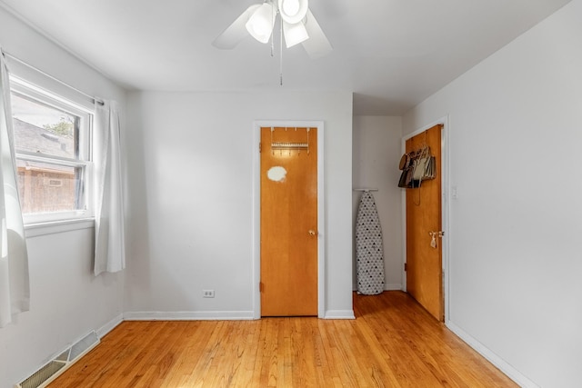 unfurnished room with light hardwood / wood-style floors and ceiling fan