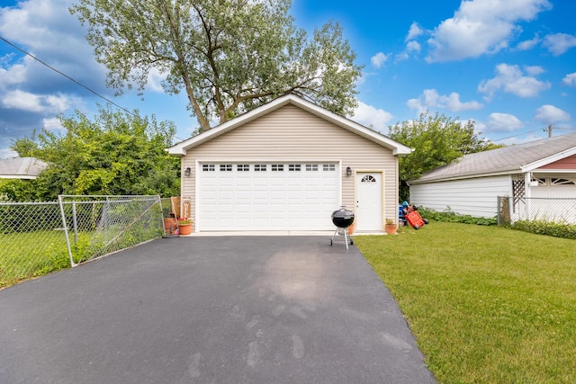 garage featuring a lawn