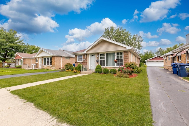 ranch-style house featuring an outbuilding, a garage, covered porch, and a front yard