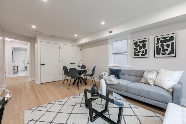 living room with light hardwood / wood-style floors