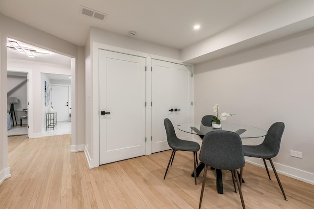 dining room with light wood-type flooring