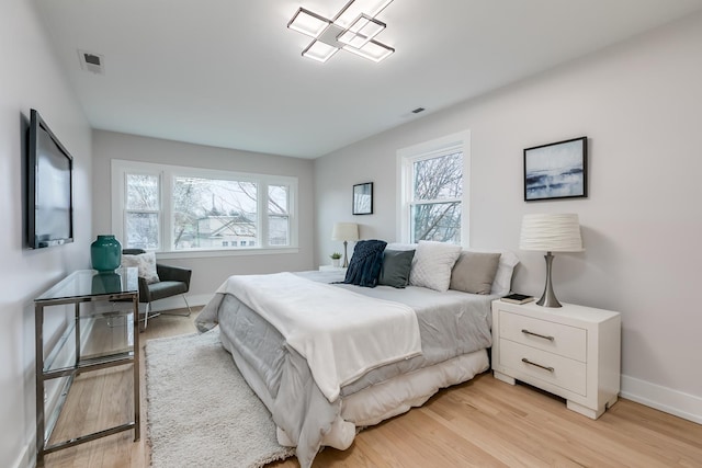 bedroom featuring light hardwood / wood-style floors