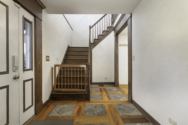 stairway featuring wood-type flooring