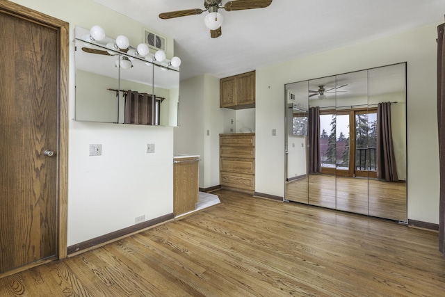 interior space featuring hardwood / wood-style flooring and ceiling fan