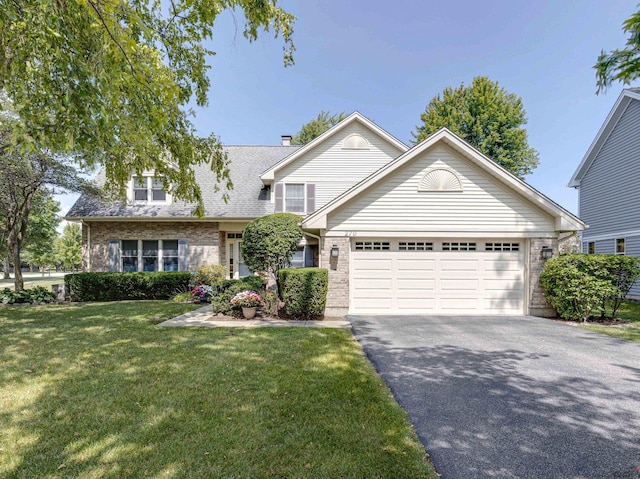 front facade with a garage and a front lawn