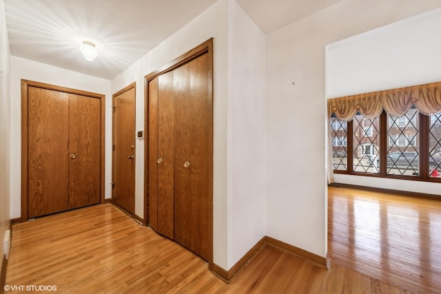 hallway featuring light wood-type flooring