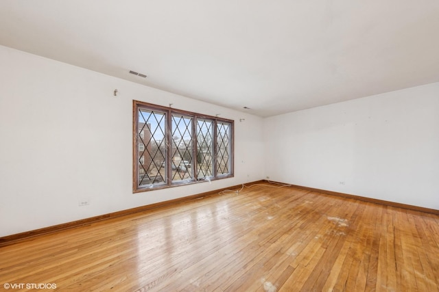 spare room with light wood-type flooring