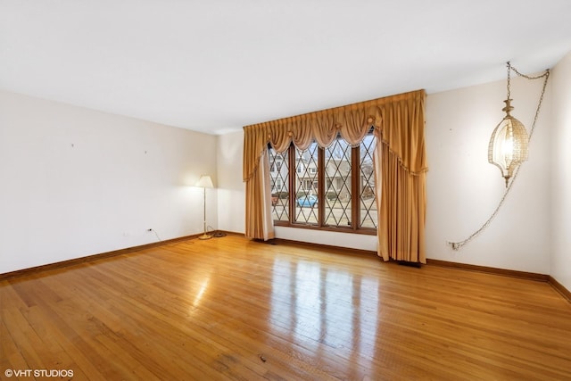 unfurnished room with light hardwood / wood-style floors