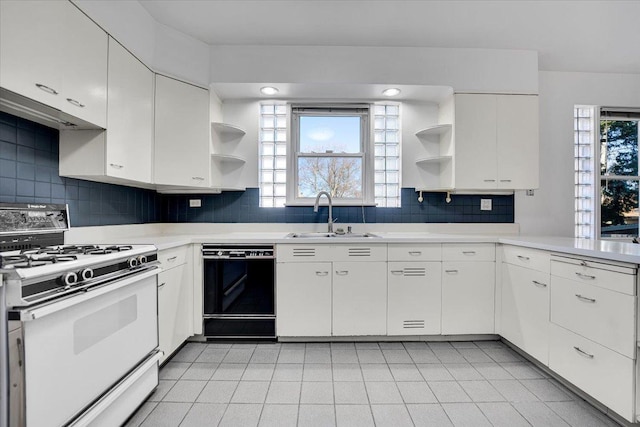 kitchen with white cabinetry, white range with gas cooktop, black dishwasher, and sink