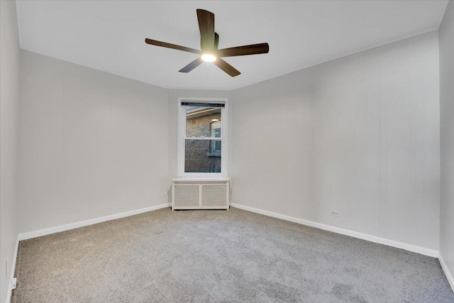 empty room with carpet flooring and ceiling fan