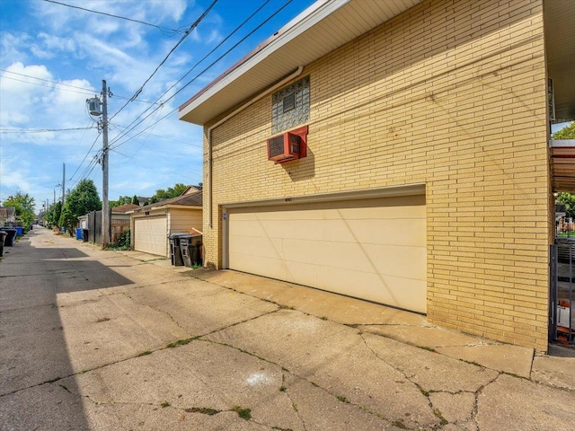 view of side of home with a garage