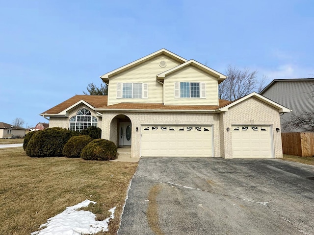 view of front property with a garage and a front lawn