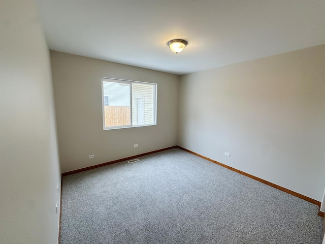 spare room featuring carpet floors