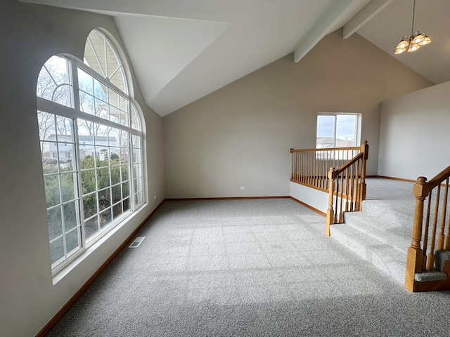 unfurnished living room featuring high vaulted ceiling, a chandelier, beamed ceiling, and carpet flooring