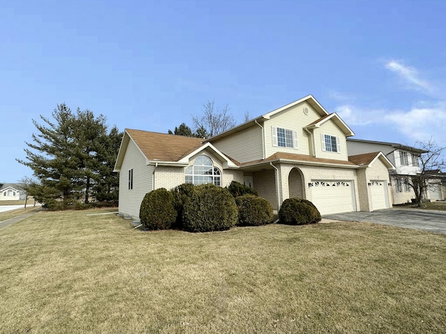 front of property with a garage and a front yard