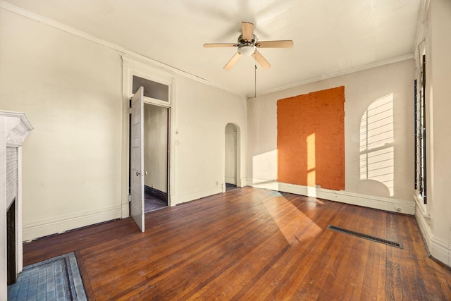 unfurnished bedroom with crown molding, dark hardwood / wood-style floors, and ceiling fan