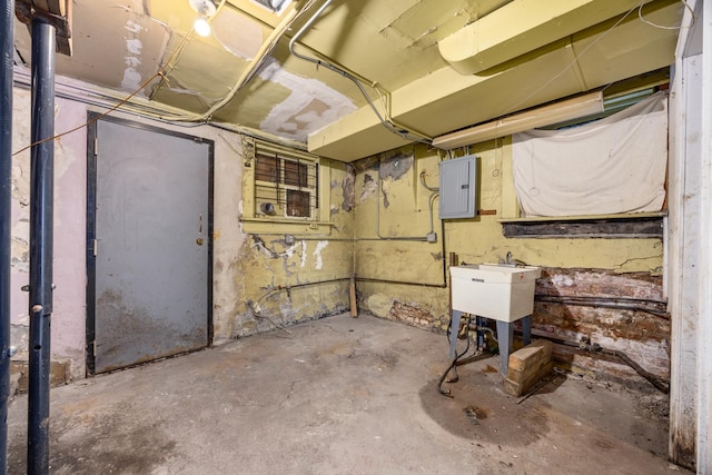 basement with sink and electric panel