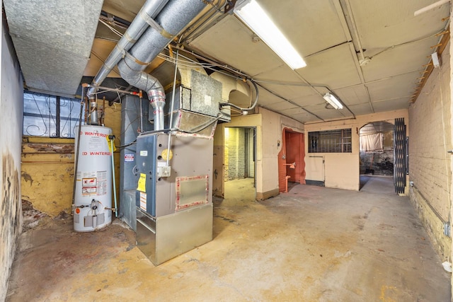 basement featuring heating unit and gas water heater