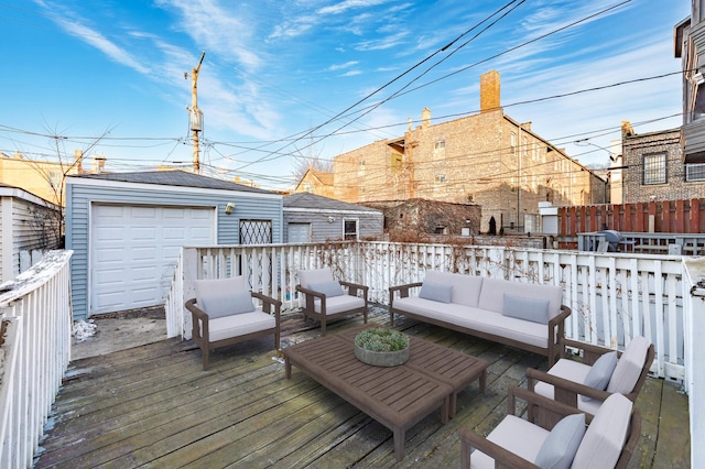 deck with an outdoor living space, a garage, and an outdoor structure