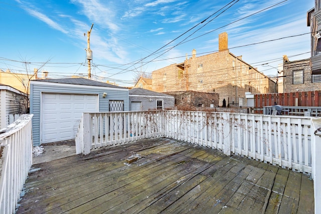 deck with an outbuilding and a garage