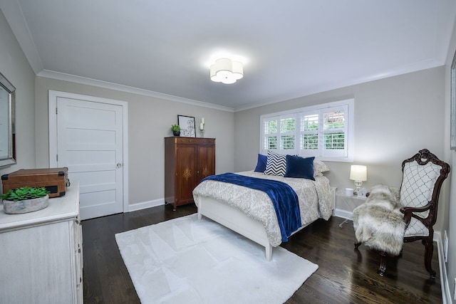 bedroom with crown molding and dark wood-type flooring