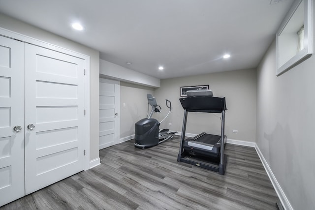 workout room with hardwood / wood-style flooring