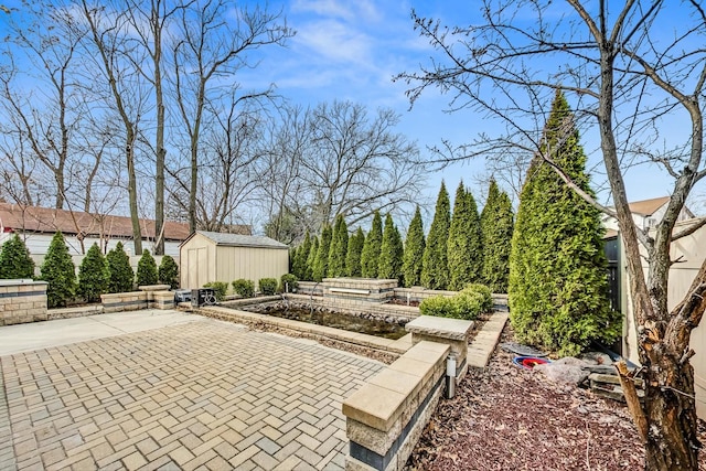 view of patio featuring a storage shed