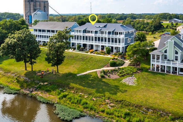 birds eye view of property with a water view