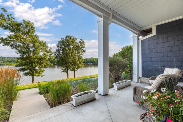 view of patio featuring a water view