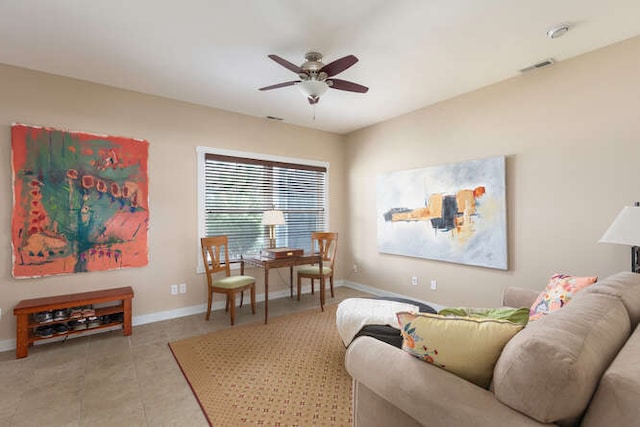 tiled living room with ceiling fan