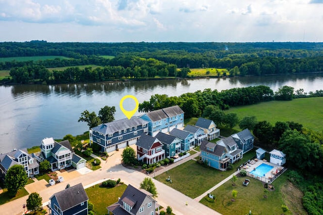 birds eye view of property with a water view