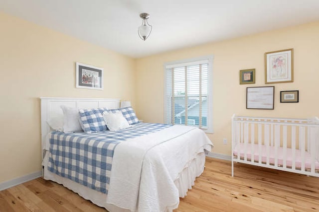 bedroom with light hardwood / wood-style floors