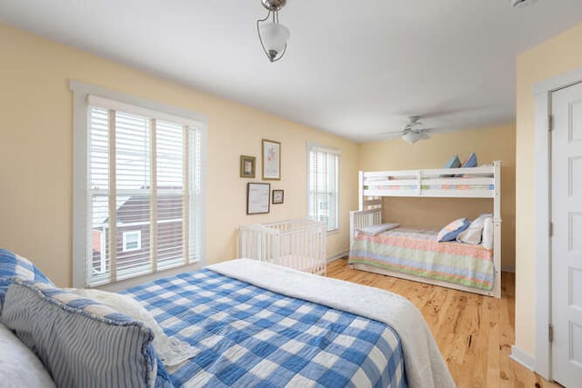 bedroom featuring hardwood / wood-style flooring and ceiling fan