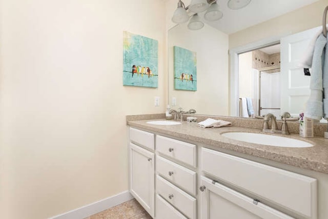 bathroom featuring vanity and a shower