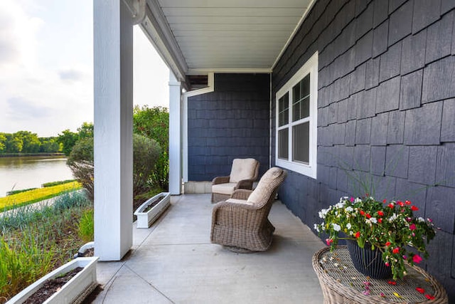 view of patio / terrace with a water view