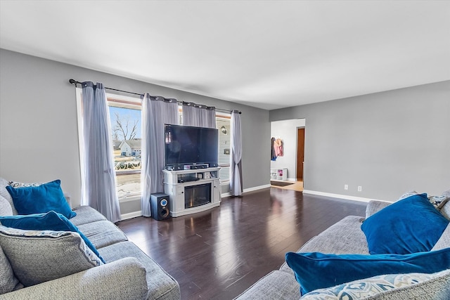 living room with dark hardwood / wood-style flooring