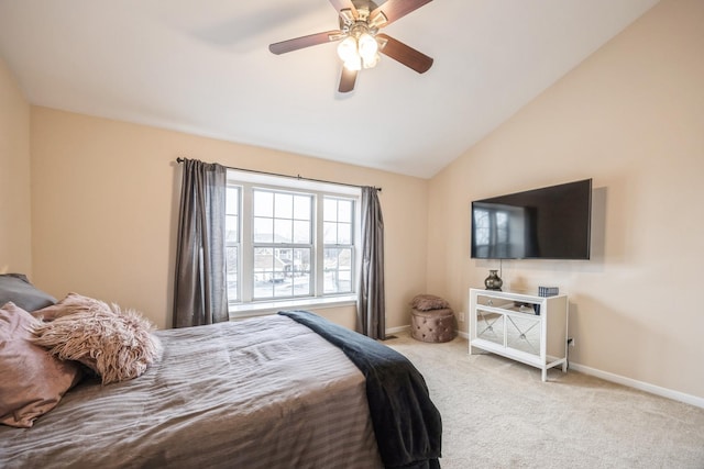 carpeted bedroom with vaulted ceiling and ceiling fan