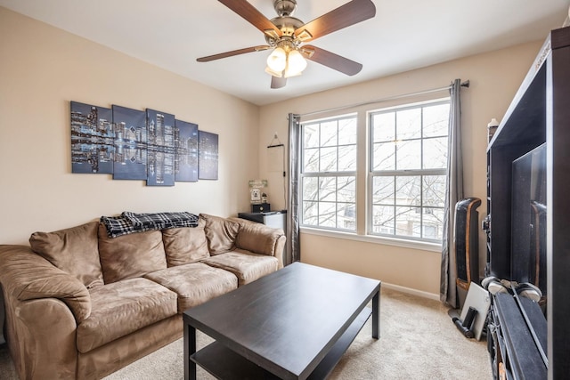 living room with light colored carpet and ceiling fan