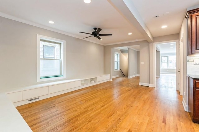 unfurnished living room featuring recessed lighting, visible vents, crown molding, and ceiling fan