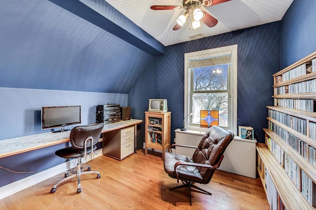 office space with wood finished floors, ceiling fan, vaulted ceiling, and visible vents