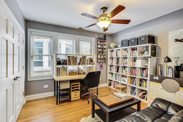 home office with wood finished floors, baseboards, and a ceiling fan
